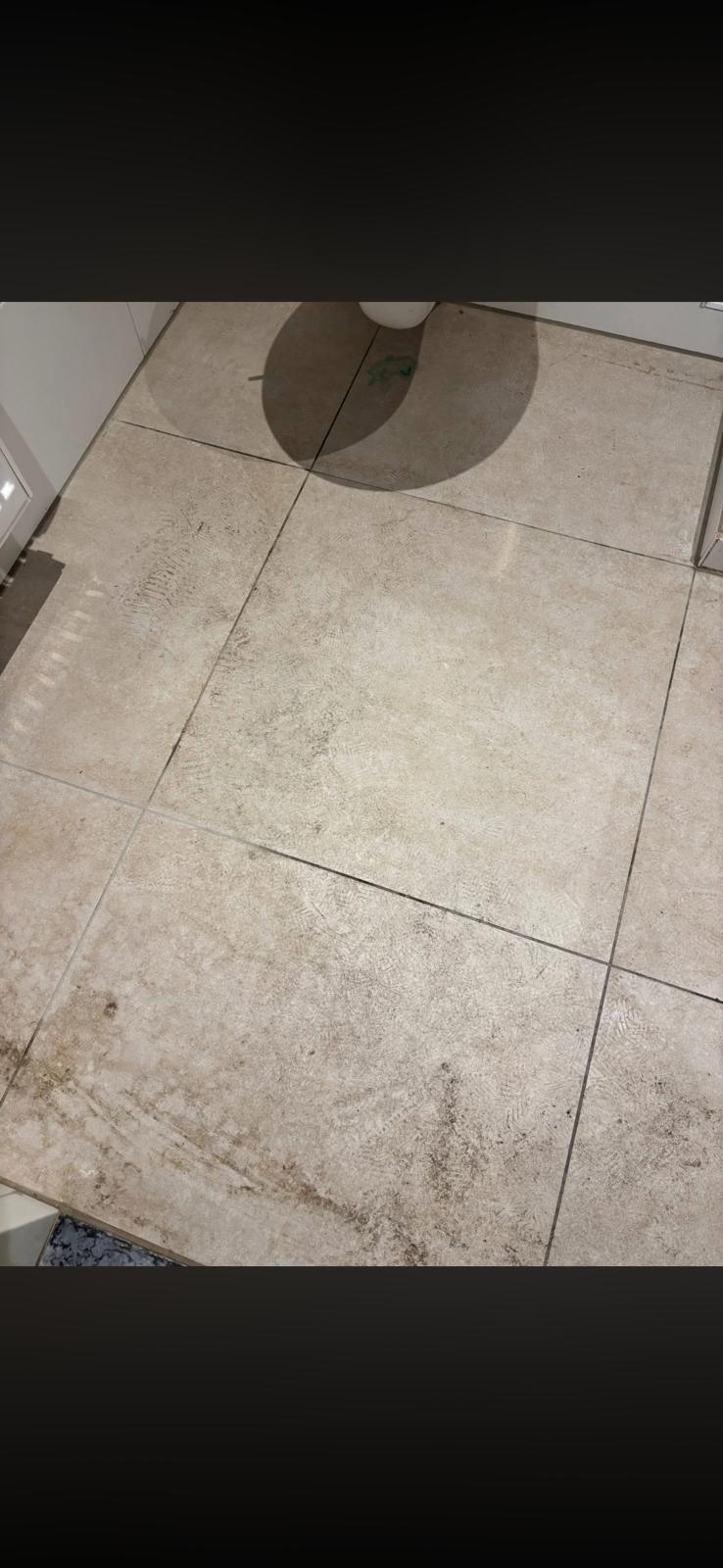 Bathroom floor before detailed rental property cleaning
